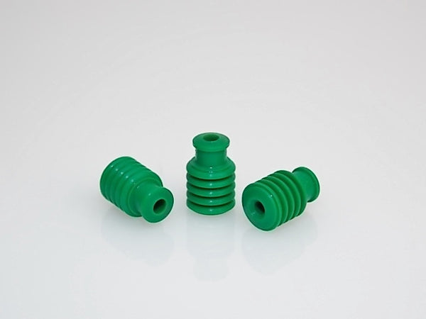 Three green Furukawa Electric RFW-W-D125 ribbed wire seals